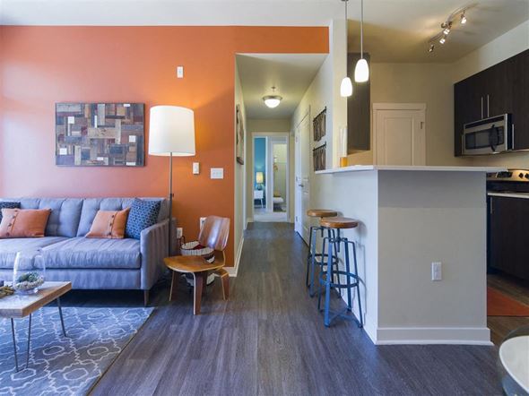 Bothell apartment for rent - a living room and kitchen with a couch and a bar