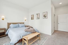 Hingham apartment for rent - a bedroom with a bed and a wooden bench