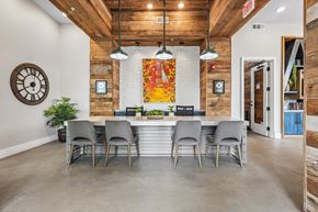 Charlotte apartment for rent - A dining room with a large table and grey chairs.