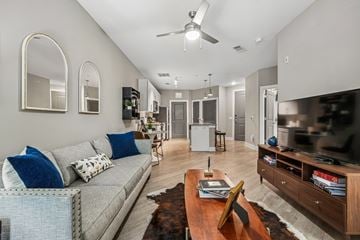 Charlotte apartment for rent - A living room with a grey couch and a wooden coffee table.