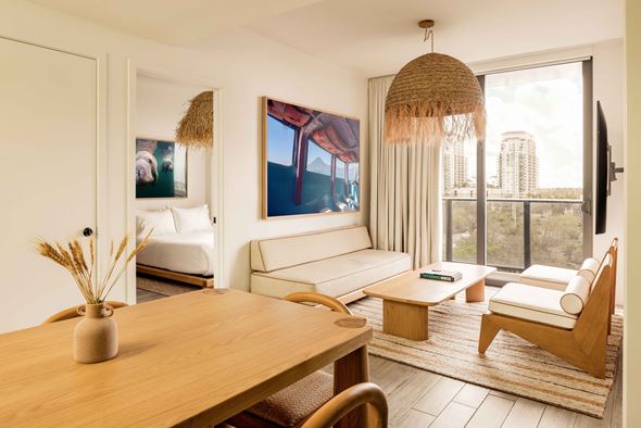 Fort Lauderdale apartment for rent - A living room with a couch, a chair, a table, and a painting on the wall.