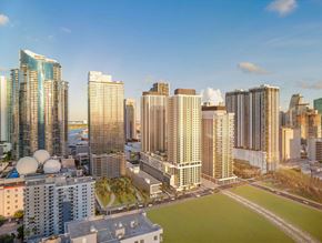 Miami apartment for rent - A cityscape with tall buildings and a clear sky.