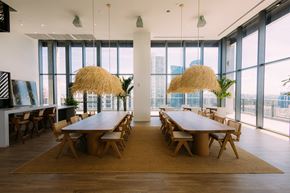 Fort Lauderdale apartment for rent - a dining room with large windows and a table and chairs