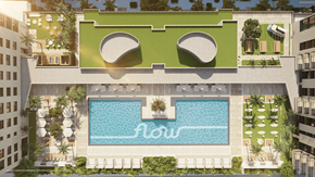 Miami apartment for rent - A modern building with a pool and a green roof.