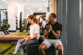 Miami apartment for rent - a man and a woman talking in a gym