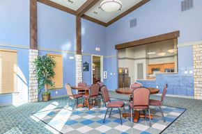 Dallas apartment for rent - a dining room with tables and chairs in a lobby