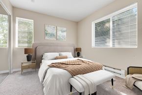Everett apartment for rent - a bedroom with a large bed and two windows at Sage Apartments, Washington