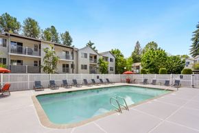 Everett apartment for rent - our apartments have a resort style pool with chairs at Sage Apartments, Everett