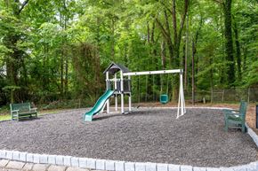 Winston-Salem apartment for rent - a playground with a swing set and a slide