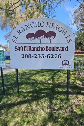 Pocatello apartment for rent - A sign for El Rancho Heights with a phone number on it.
