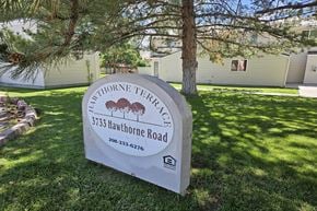 Pocatello apartment for rent - A sign for Hawthorne Terrace stands in a grassy area.