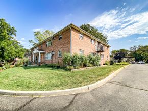 Madison apartment for rent - the view of a brick apartment building from the street