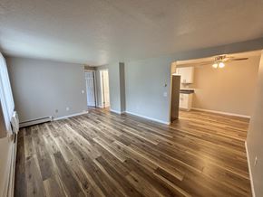Madison apartment for rent - A room with wooden flooring and white walls.