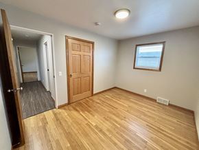 Madison apartment for rent - A room with a wooden floor and a door.