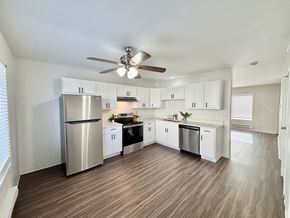 Sun Prairie townhouse for rent - A spacious kitchen with a refrigerator, stove, and oven.