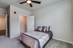 Kenosha apartment for rent - a bedroom with a bed and a ceiling fan