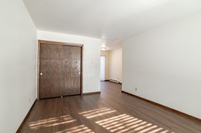 Stevens Point apartment for rent - a living room with a wooden door and a hard wood floor