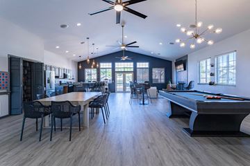 Plover apartment for rent - an open living room with a pool table and a dining room