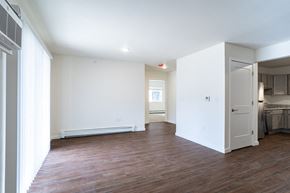 Plover apartment for rent - a living room with white walls and a wood floor