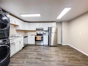 Madison apartment for rent - a kitchen with white cabinets and stainless steel appliances
