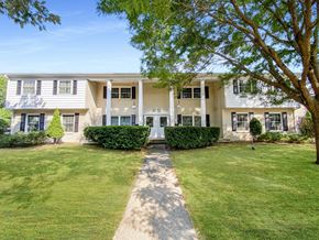 Madison apartment for rent - a white house with a lawn and trees in front of it