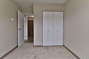 Appleton apartment for rent - a bedroom with two closets and a carpeted floor