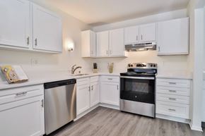 Oak Creek apartment for rent - A kitchen with white cabinets and stainless steel appliances.
