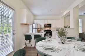 Brookfield townhouse for rent - A modern kitchen with a dining table set for two.