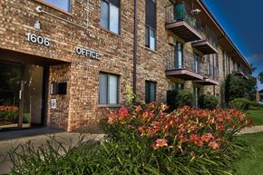 Waukesha apartment for rent - A brick building with the number 1606 and the word office on it.
