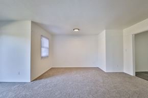 De Pere apartment for rent - A room with a carpeted floor and a window.