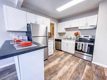Madison apartment for rent - a kitchen with stainless steel appliances and white cabinets