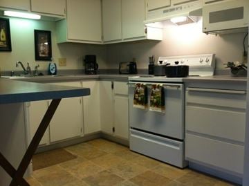 Wausau apartment for rent - A kitchen with a white oven and a blue counter.