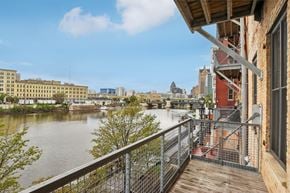 Milwaukee apartment for rent - the view of the river from the balcony of a building with a balcony railing