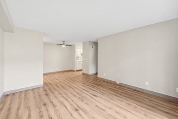 Brookfield apartment for rent - a living room with a hard wood floor and white walls