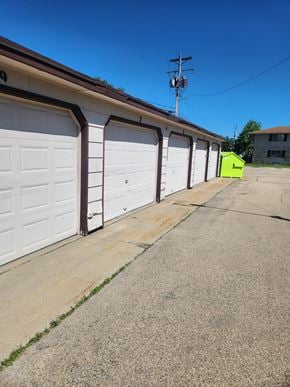 Appleton apartment for rent - a row of garage doors on the side of a building