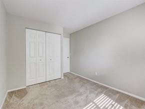West Bend apartment for rent - a bedroom with two closets and a carpeted floor