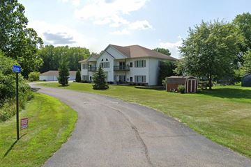 Jefferson apartment for rent - A road leading to a large white house with a red roof.