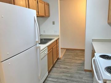 Ladysmith apartment for rent - A kitchen with a white refrigerator and a white stove.