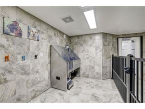 Wauwatosa apartment for rent - the elevator in the lobby of a building with marble walls