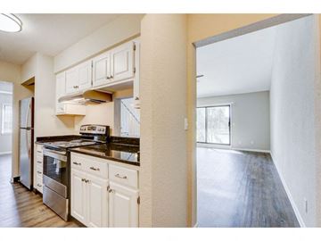 Oconomowoc apartment for rent - a kitchen with white cabinets and stainless steel appliances
