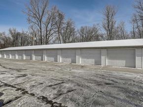 Appleton apartment for rent - a building with white doors and a parking lot