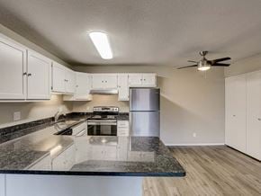 Appleton apartment for rent - A kitchen with a granite countertop and stainless steel appliances.