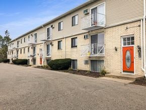 Madison apartment for rent - a building with a red door on the side of a street