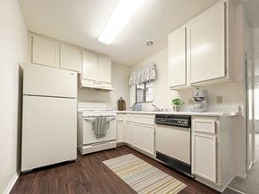 Hemet apartment for rent - kitchen with white cabinets and appliances at Azul Apartments, Hemet, CA, 92545