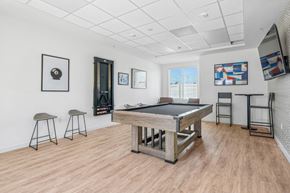 Moreno Valley apartment for rent - Game room at Altitude apartment homes with tv, pool table, and darts for the ultimate hangout.