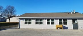 Kokomo apartment for rent - the front of a white building with a garage door