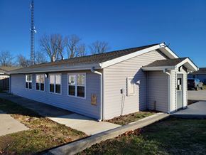 Kokomo apartment for rent - a small white house with a sidewalk in front of it