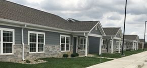 Kokomo triplex for rent - a row of houses on the side of a street