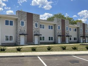 Marion triplex for rent - an image of a row of apartment buildings on a city street