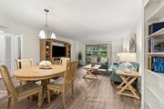 Clearwater apartment for rent - A well-lit, spacious dining room with a wooden table and chairs at Hampton Apartments, Clearwater 33759